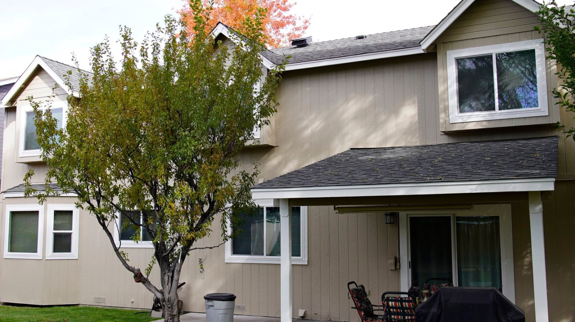 Two-story exterior repaint with crisp white trim