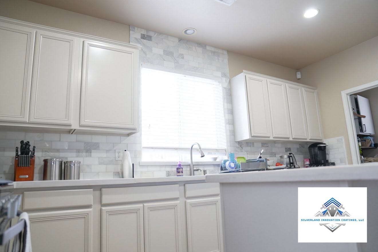 Kitchen cabinets refinished in a soft white