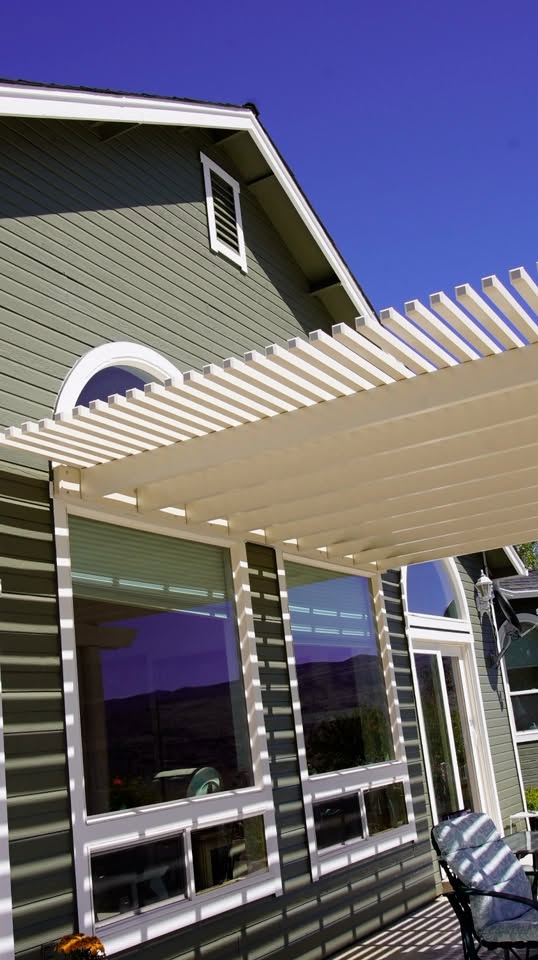 Patio pergola and siding coated to handle sun and wind