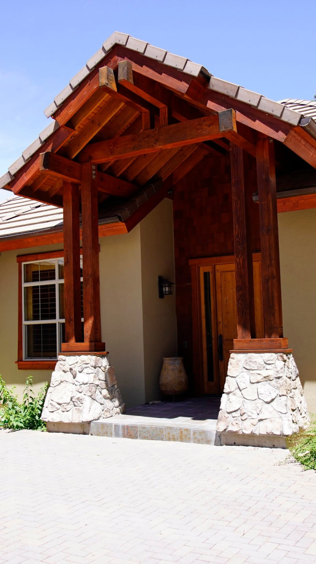 Stained timber entry beams, columns and front door