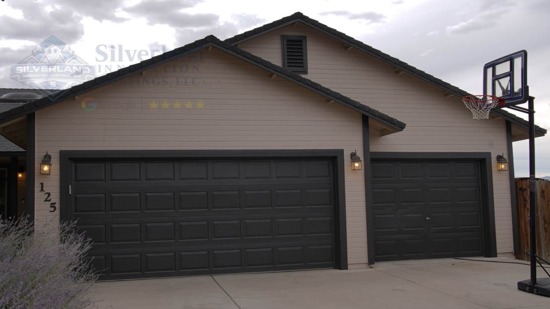 Garage doors and trim painted in a bold dark finish